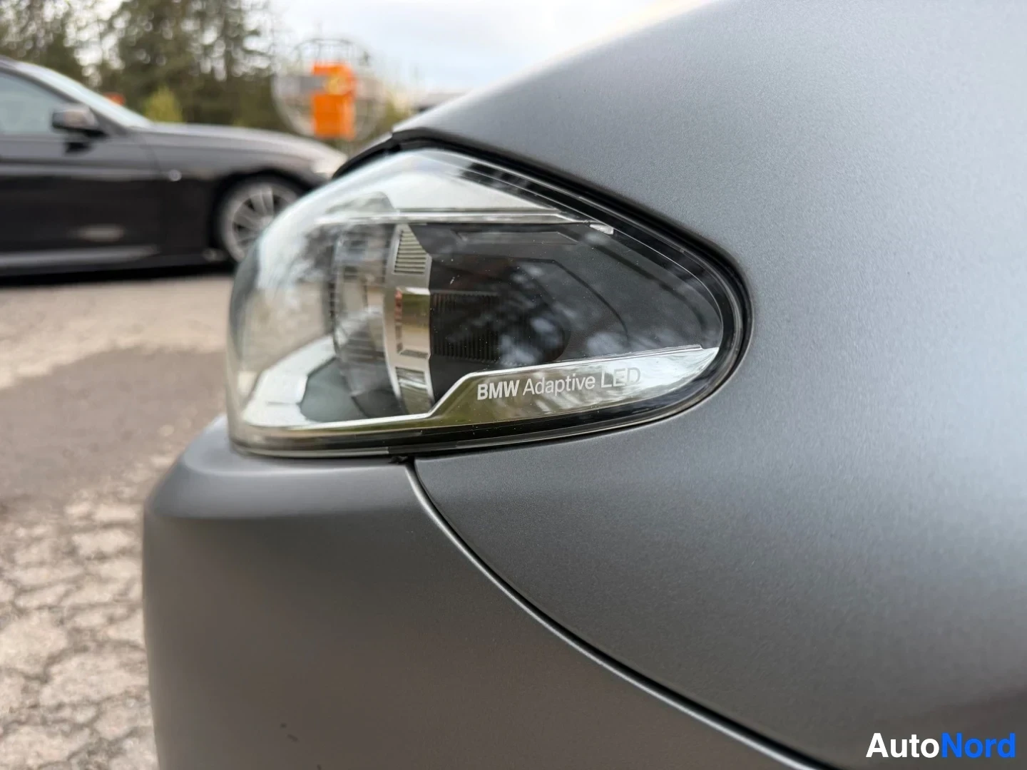 BMW Adaptive LED headlight on gray car's front quarter panel
