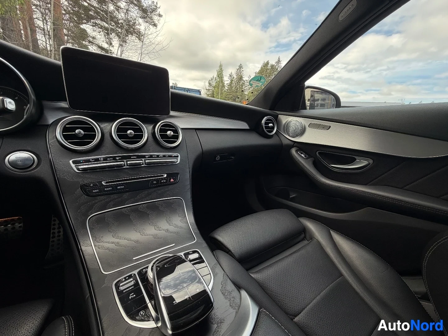 Center console with air vents and climate control buttons