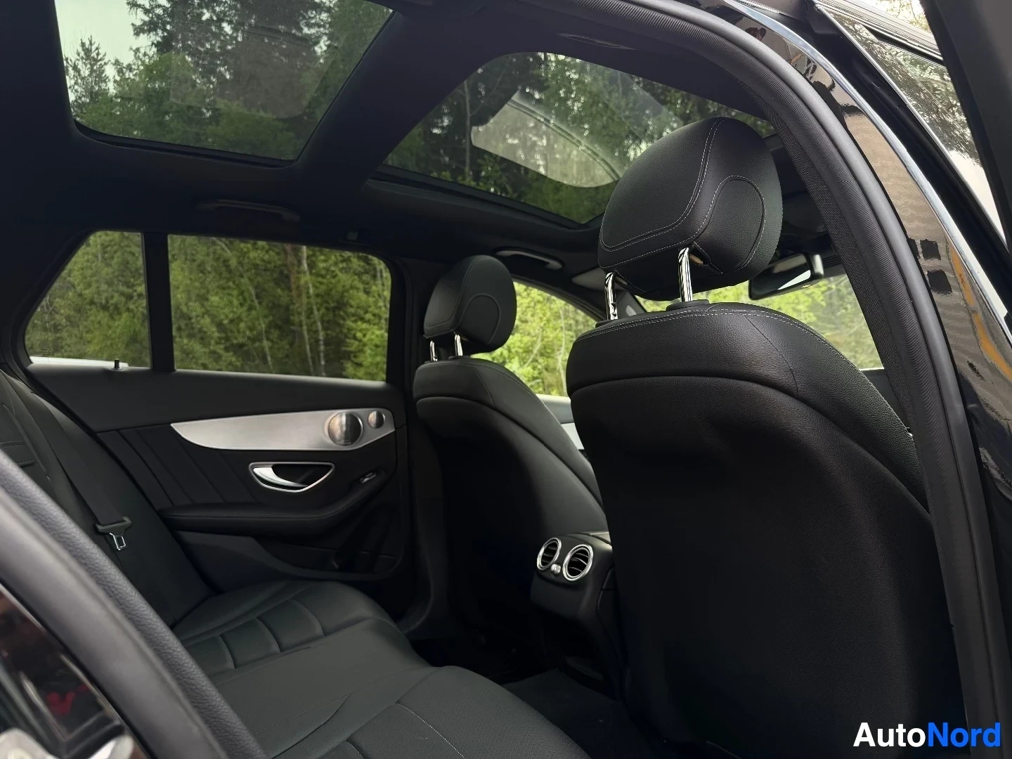 Rear interior with panoramic sunroof and back seat area
