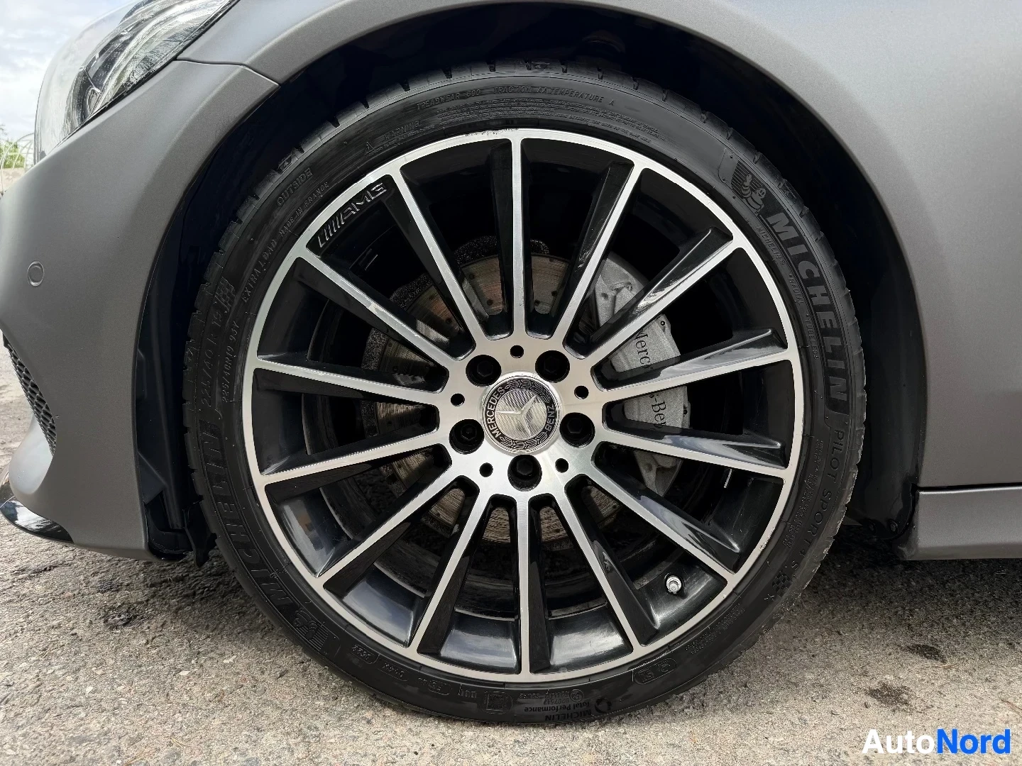Multi-spoke alloy wheel with Michelin tire mounted on vehicle