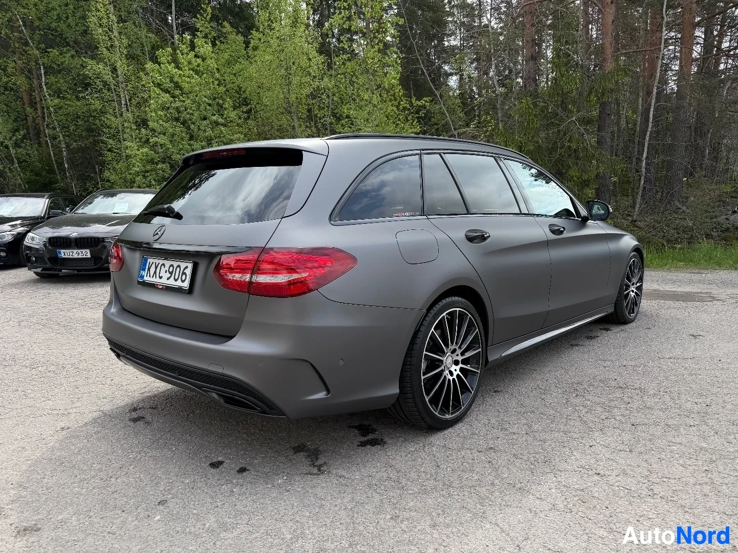 Grey Mercedes-Benz station wagon photographed from side three-quarter angle