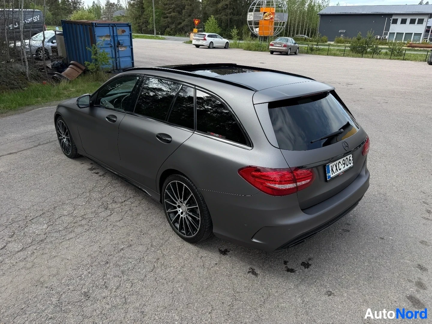 Grey Mercedes-Benz station wagon photographed from front three-quarter angle