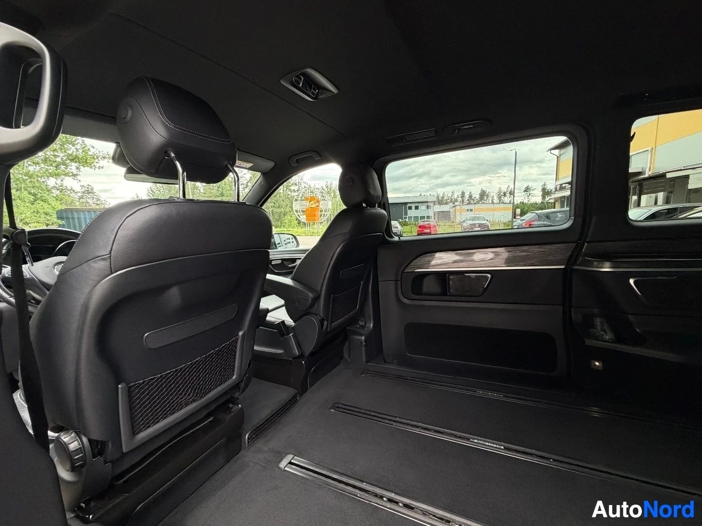 Rear cargo section with front seat visible and side windows