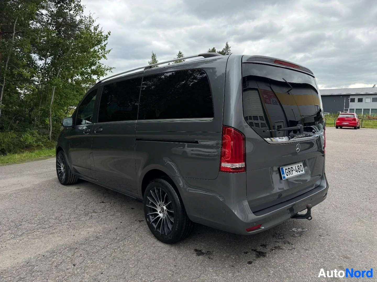 Gray Mercedes-Benz van from rear three-quarter angle showing tail lights and side