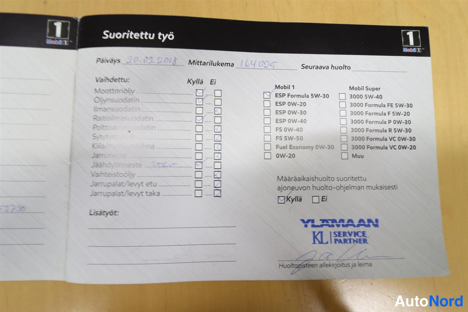 Asiakirja: Huoltokirjan sivu Suoritettu työ, päiväys 20.02.2018, mittarilukema 164095, Ylämaan KL Service Partner -leima