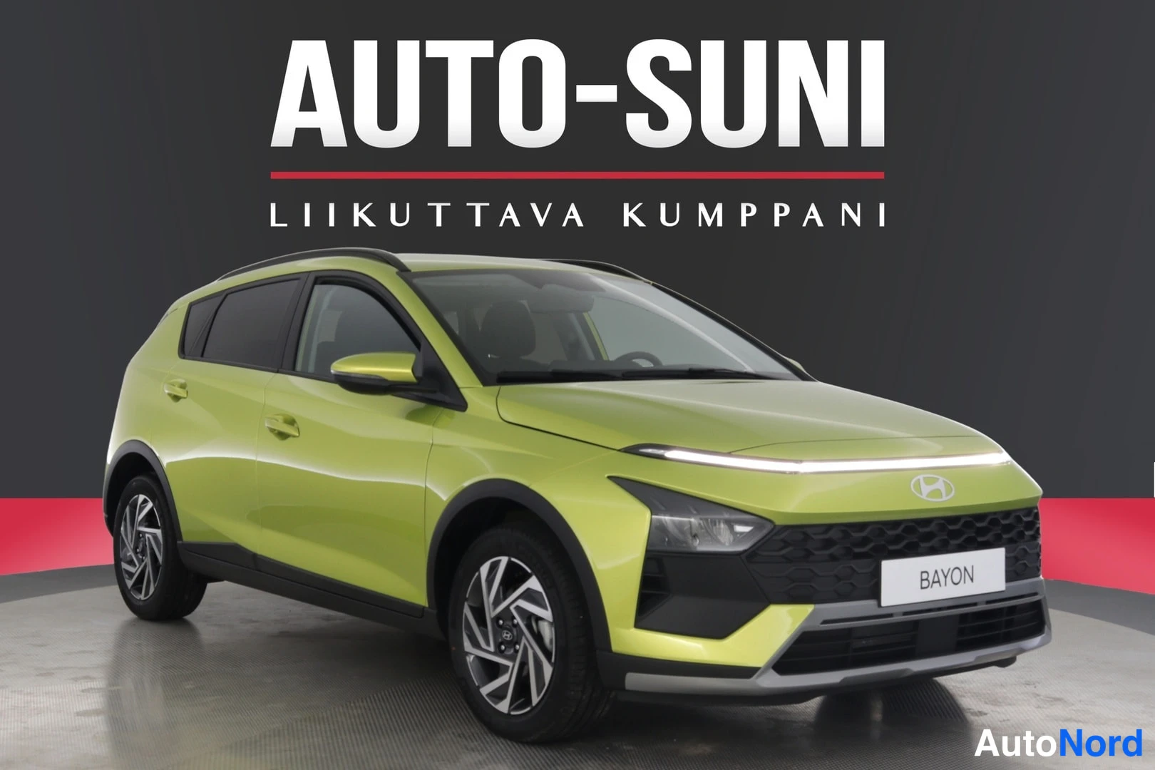 Muu: Front three-quarter view of a lime green hatchback with front grille and driver's side flank visible; LED daytime running light strips are illuminated