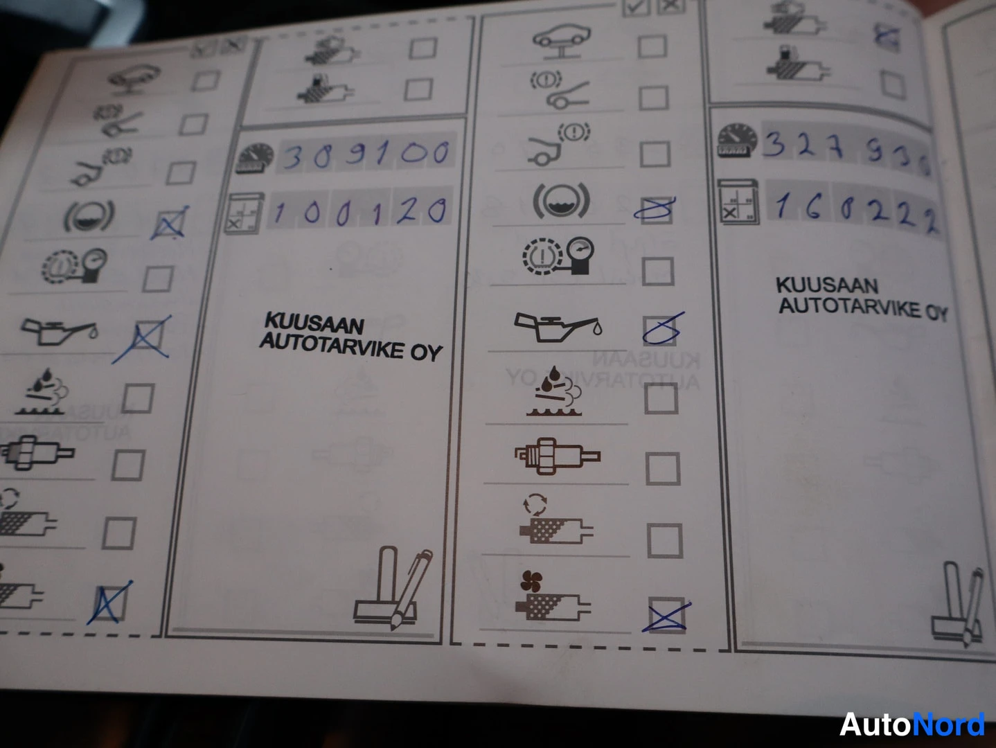 Asiakirja: Huoltokirjan sivu KUUSAAN AUTOTARVIKE OY, käsin kirjoitettu matkamittarilukema 309100 ja päivämäärä 100120, rastilla olevia huolto-kohtia.