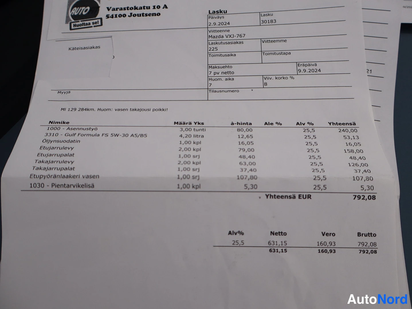 Asiakirja: Lasku autokorjaamolta: Mazda, työsuorituksia ja varaosia, yhteensä 792,08 EUR.