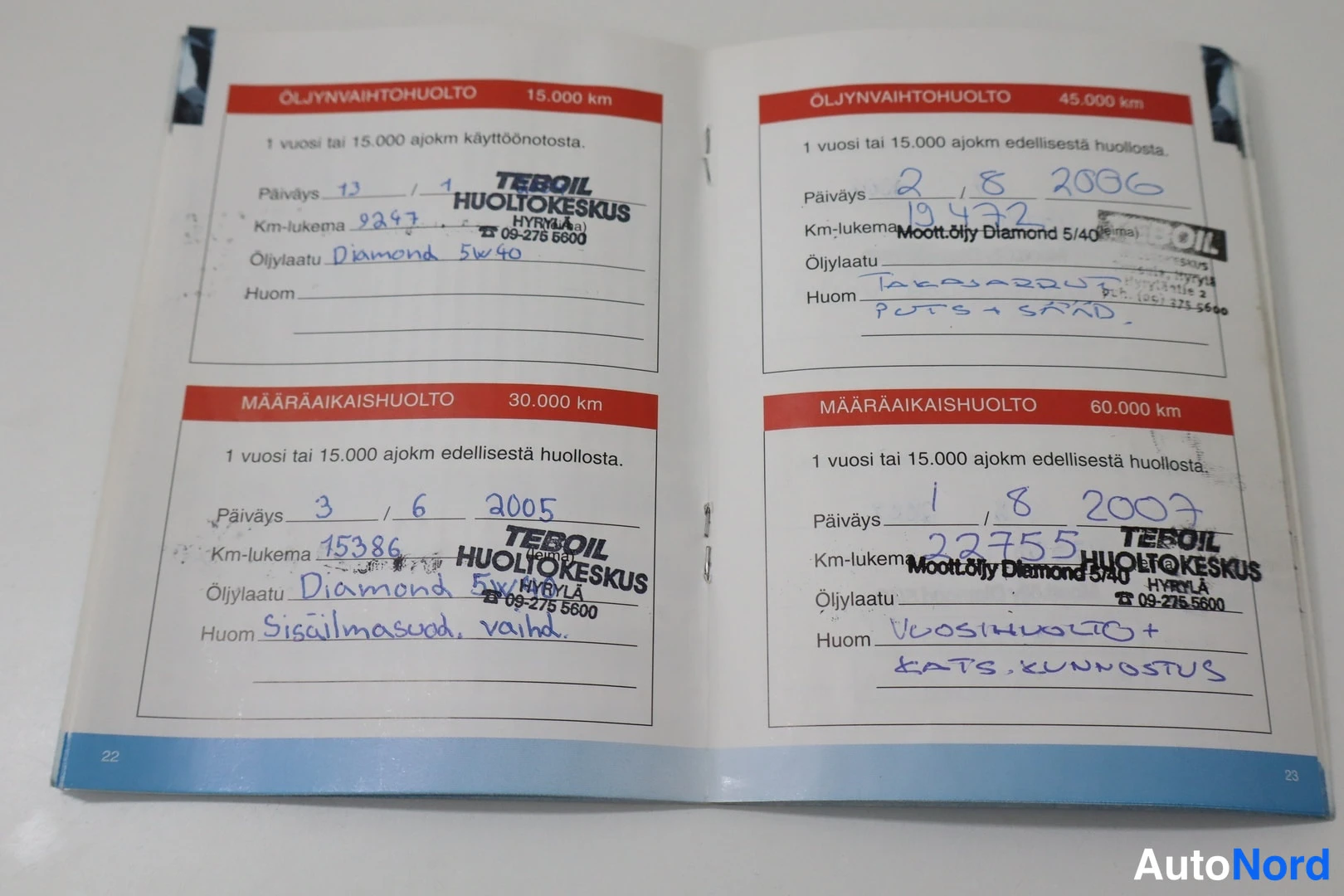 Asiakirja: Service booklet showing four maintenance entries from years 2005 through 2007 with handwritten odometer readings.