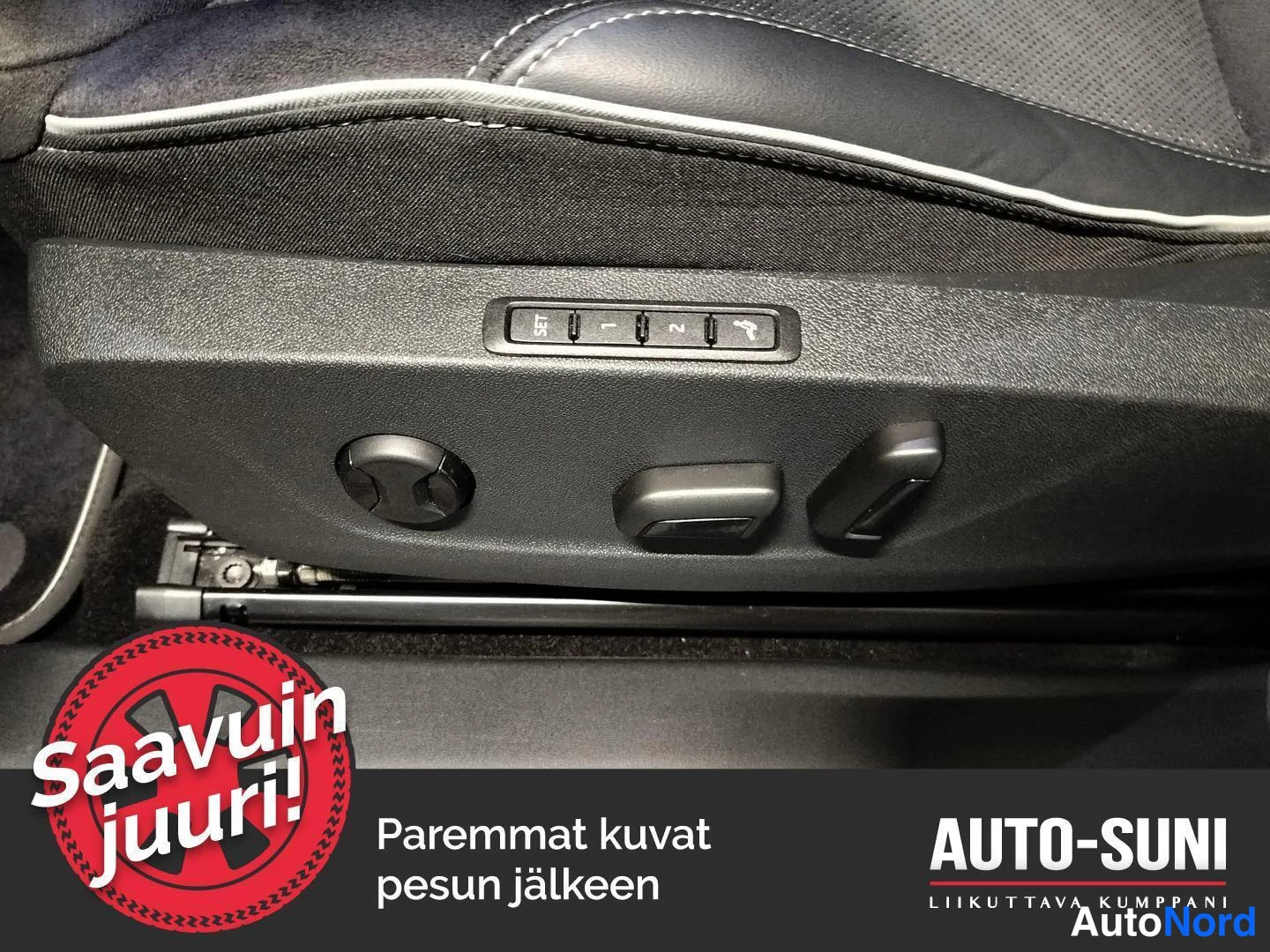 Muu: Lähikuva istuimen sivusta, jossa sähköiset istuinsäädöt ja muisti-painikkeet SET, 1 ja 2.