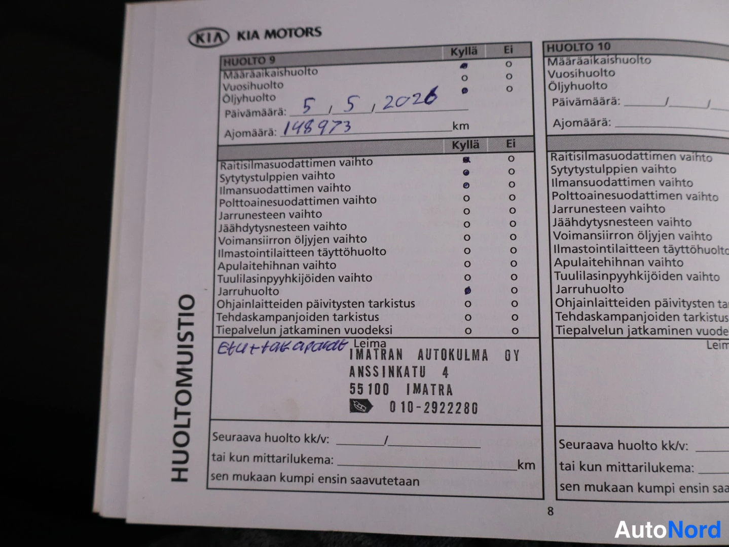 Muu: Kia-huoltokirjan sivu 8, huolto 9 merkitty päivämäärällä 5.5.2026 (148973 km), leima Imatran Autokulma Oy.