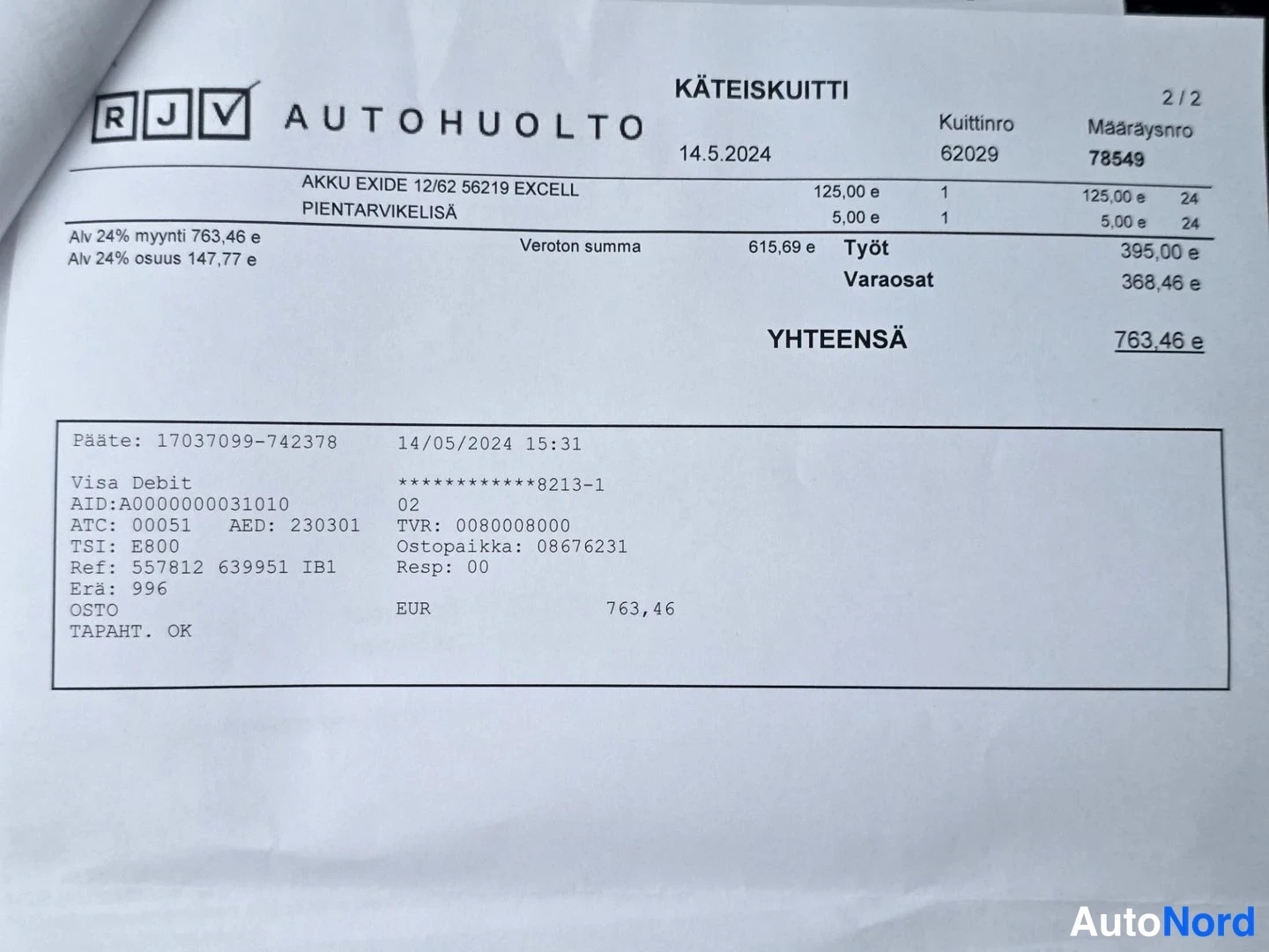 Asiakirja: Autonhuoltokuitti käteiskuitti RJV Autohuolto, päiväys 14.5.2024, yhteensä 763,46 euroa, akku Exide 12/62 ja pientarvikelyisä, Visa Debit -maksu.