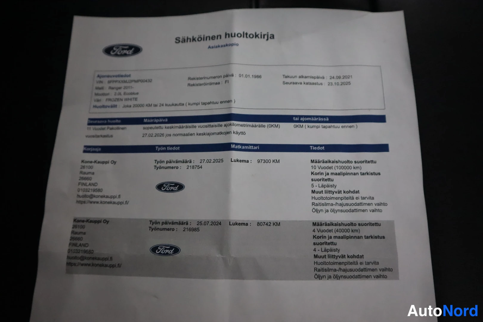 Muu: Ford-sähköisen huoltokirjan asiakaskopio, jossa huoltotiedot 2024–2025 ja ajoneuvotiedot: Ranger 2.0L EcoBlue, väri Frozen White, rekisterinumero.