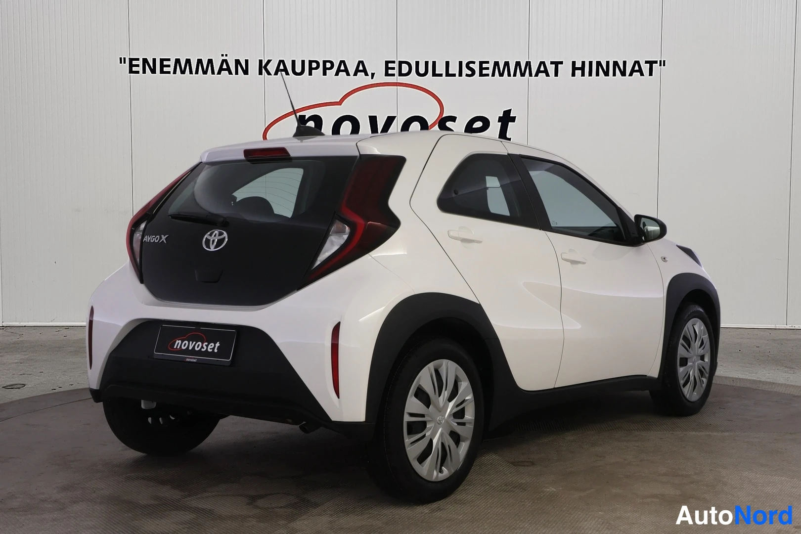 Takaviisto: Right rear three-quarter view of the white Toyota Aygo X showing the rear and right flank.