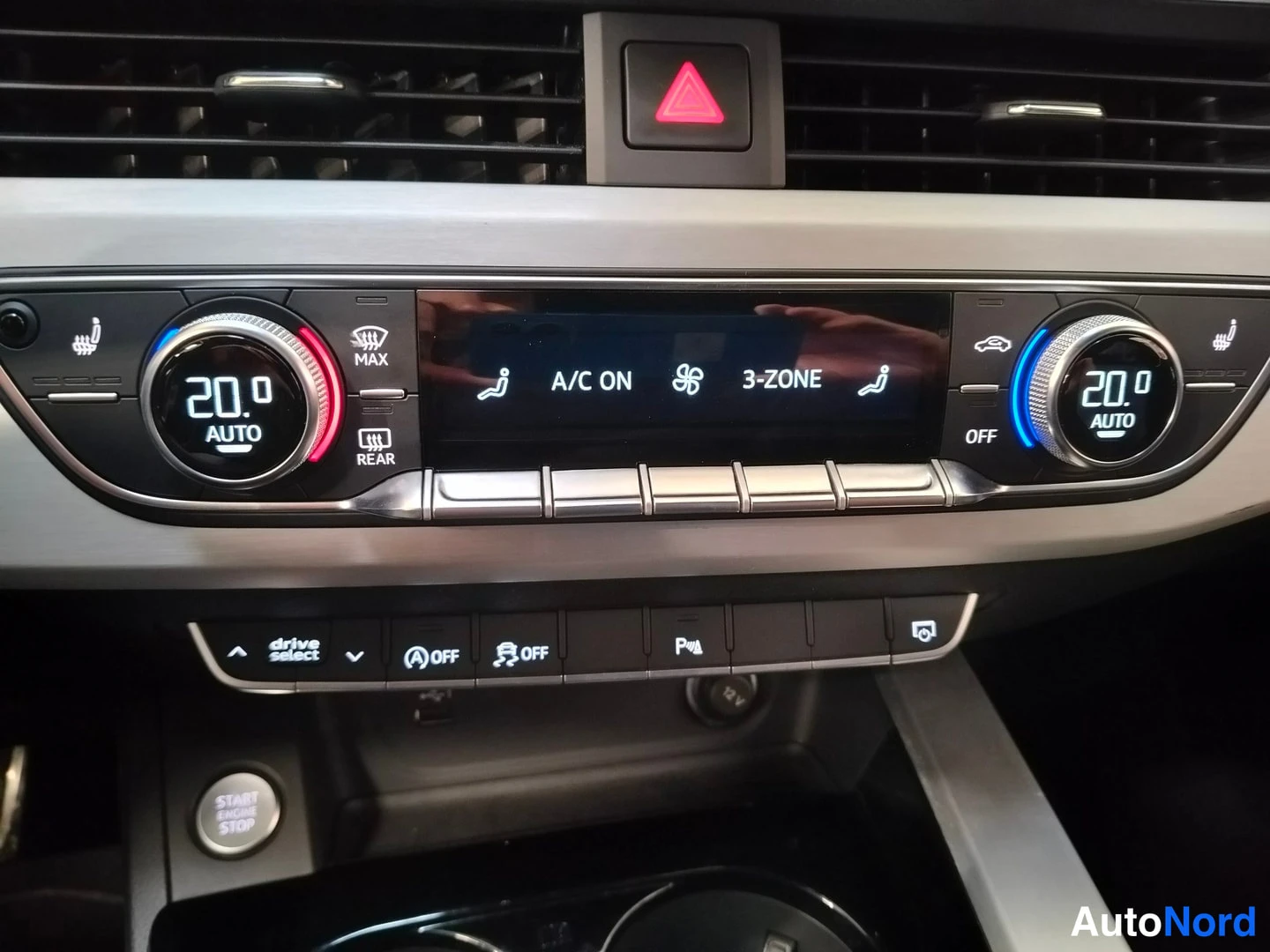Muu: Climate control panel with dual AUTO dials set to 20.0, display reading 'A/C ON' and '3-ZONE', plus drive select and parking system buttons.