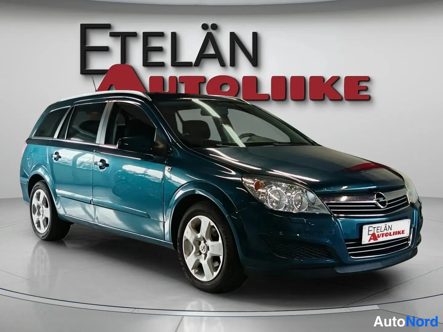Sininen Opel Astra 2007, etuviisto, keula oikealle, kuva 2