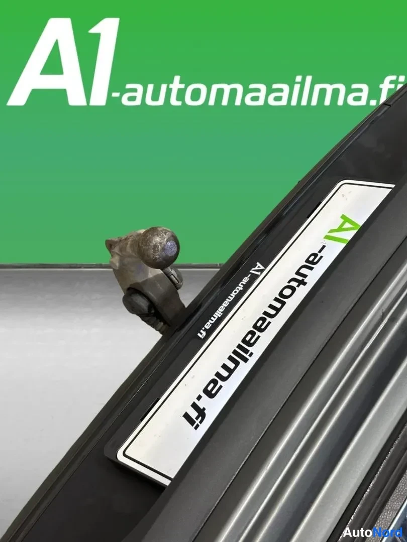 Muu: A1-automaailma.fi -kyltti autossa, teksti A1 -automaailma.fi