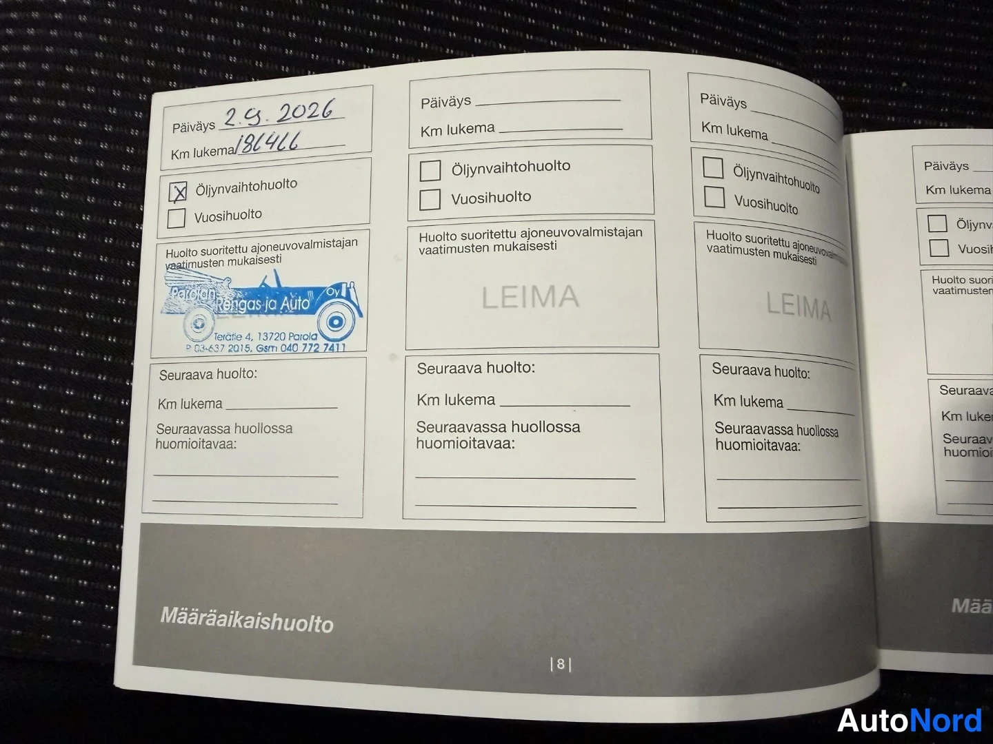 Muu: Huoltokirjan määräaikaishuolto-sivu, viimeisin merkintä 2.9.2026 ja 18446 km, leimalla Pardon Rengas ja Auto.