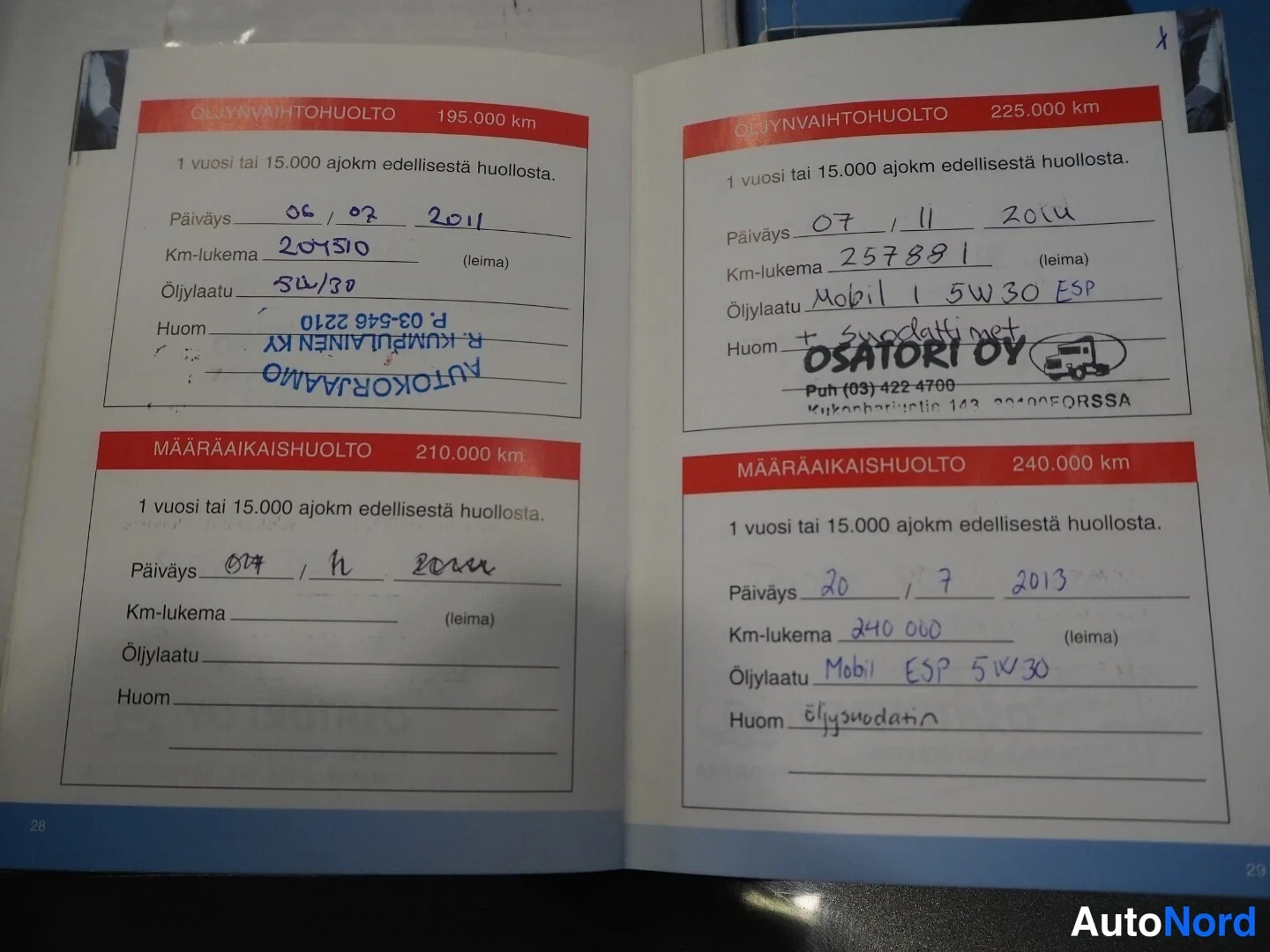 Asiakirja: A service book page showing six maintenance entries dated between July 2011 and July 2013, covering mileage from approximately 204510 km to 240060 km. Handwritt