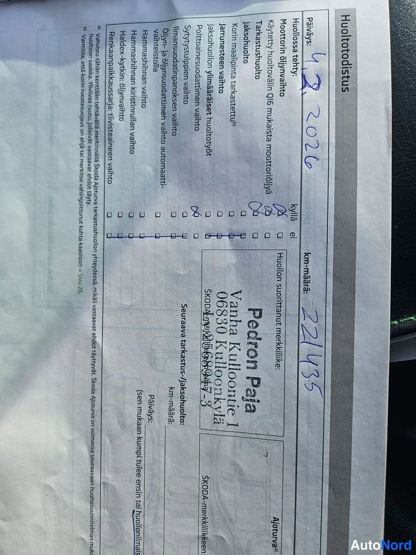 Muu: Skoda-huoltotodistus, jossa käsinkirjoitettu merkintä 11.2.2026 ja km-määrä 221135, Pedron Paja Oy:n leima.