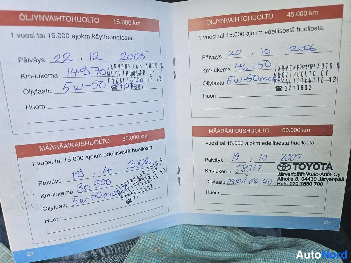 Asiakirja: A service booklet page showing entries for mileage readings of 149370 km, 46150 km, 30500 km, and 58317 km with dates ranging from 2005 to 2007.
