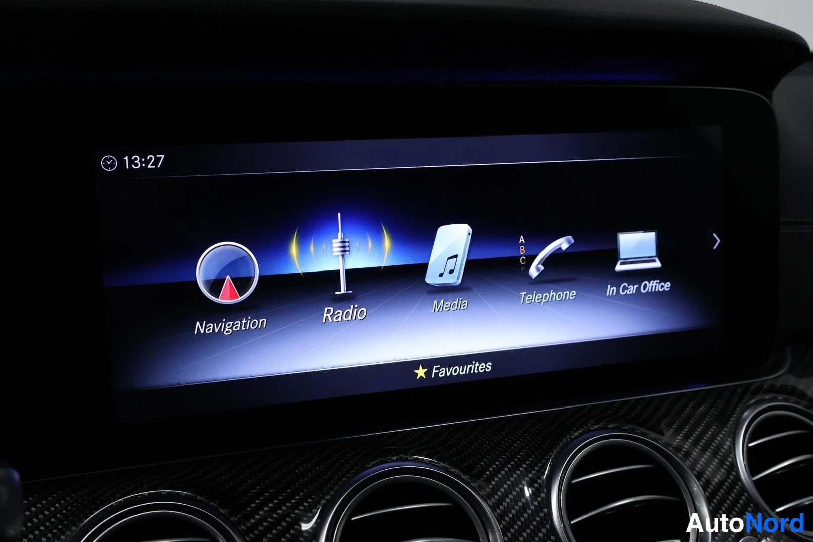 Ohjaamo: Central infotainment touchscreen showing main menu icons labeled Navigation, Radio, Media, Telephone and In Car Office.