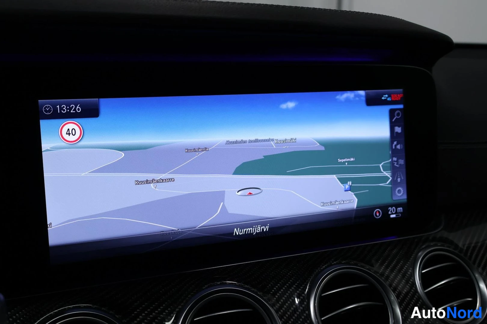 Ohjaamo: Infotainment screen displaying a navigation map centered on Nurmijärvi with visible street names Kuusimäenkaarre and Kuusimäki, and a circular red speed limit s