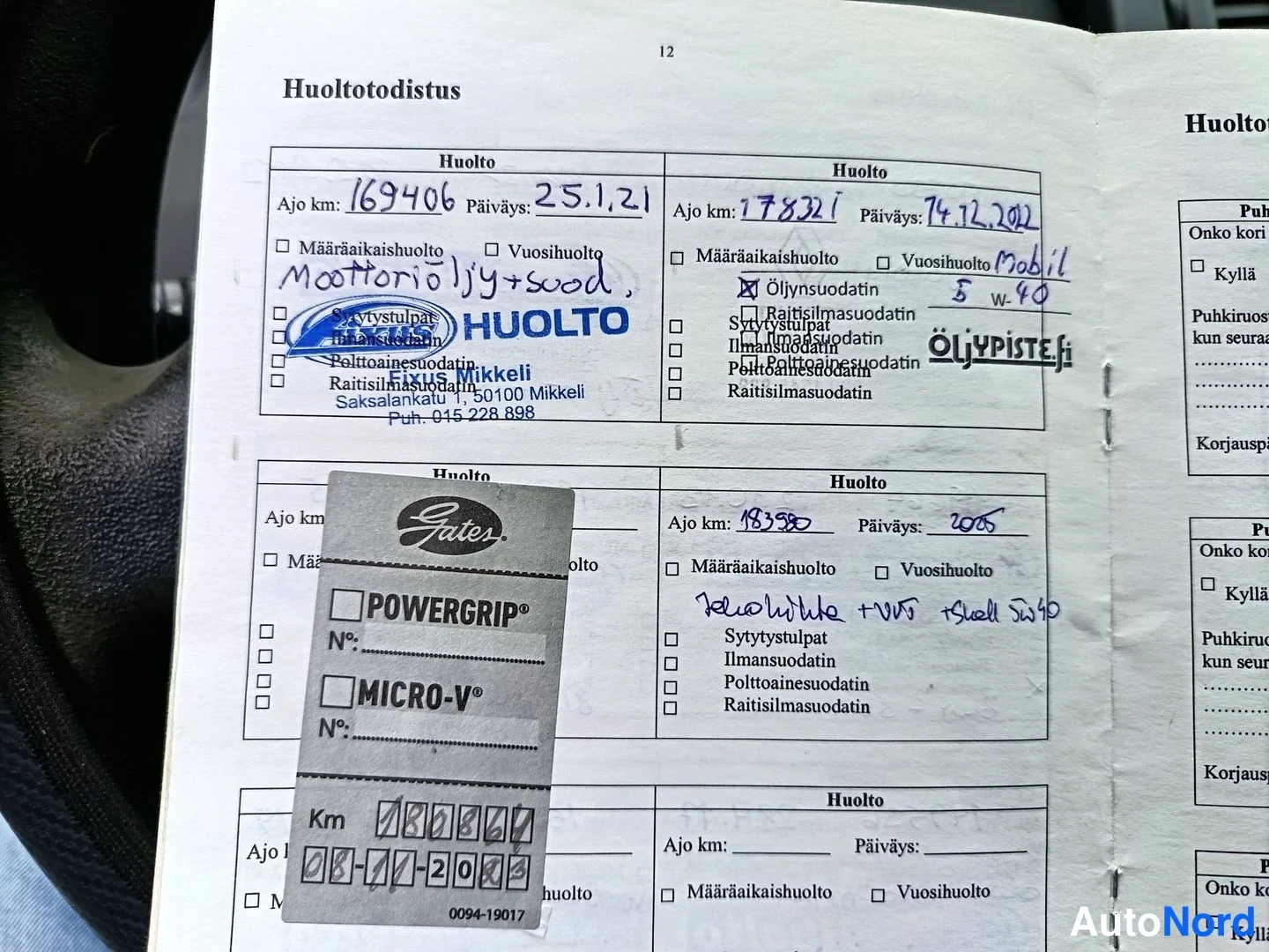 Asiakirja: Huoltotodistus, jossa käsin täytettyjä huoltomerkintöjä, mm. ajo km 169406 päiväys 25.1.21 ja ajo km 178321 päiväys 14.12.2012.