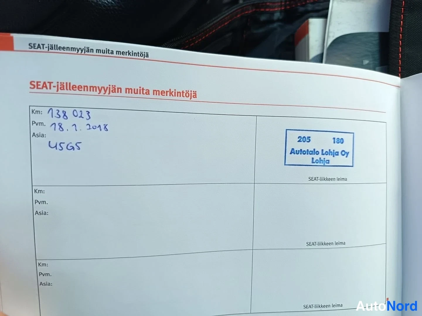 Muu: SEAT-jälleenmyyjän muita merkintöjä -sivu huoltokirjassa, merkintä 138 023 km, 18.7.2018, USGS, Autotalo Lohja Oy:n leima