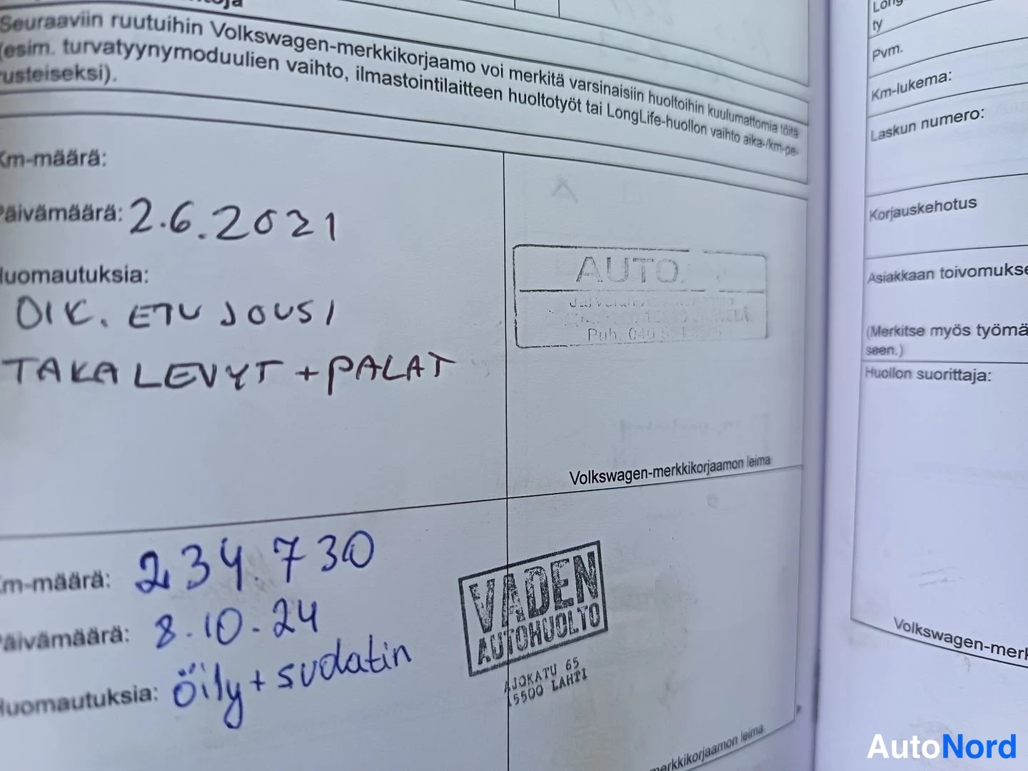 Asiakirja: Third page of a vehicle service booklet showing recent maintenance entries. Date 2.6.2021 mentions front suspension work ('OIK ETU JOUSI'). Another entry from 8