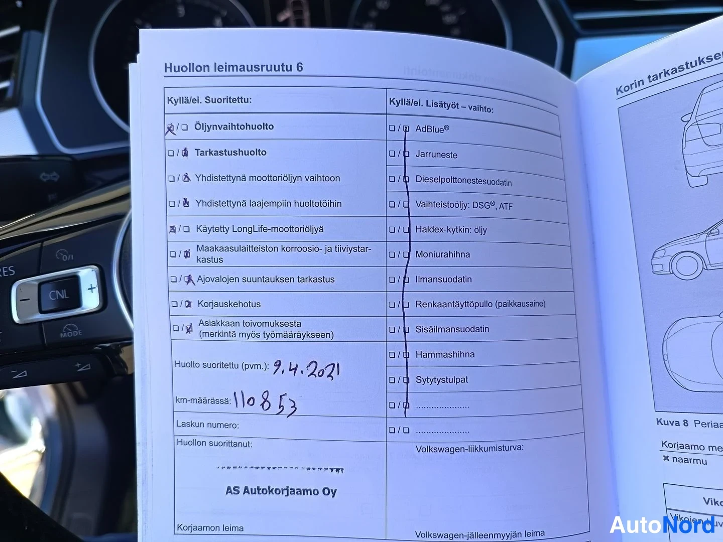 Asiakirja: Close-up of an open service book page with Finnish text, showing a checklist with several boxes ticked. Handwritten in the 'Huolto suoritettu' field is '9.4.202
