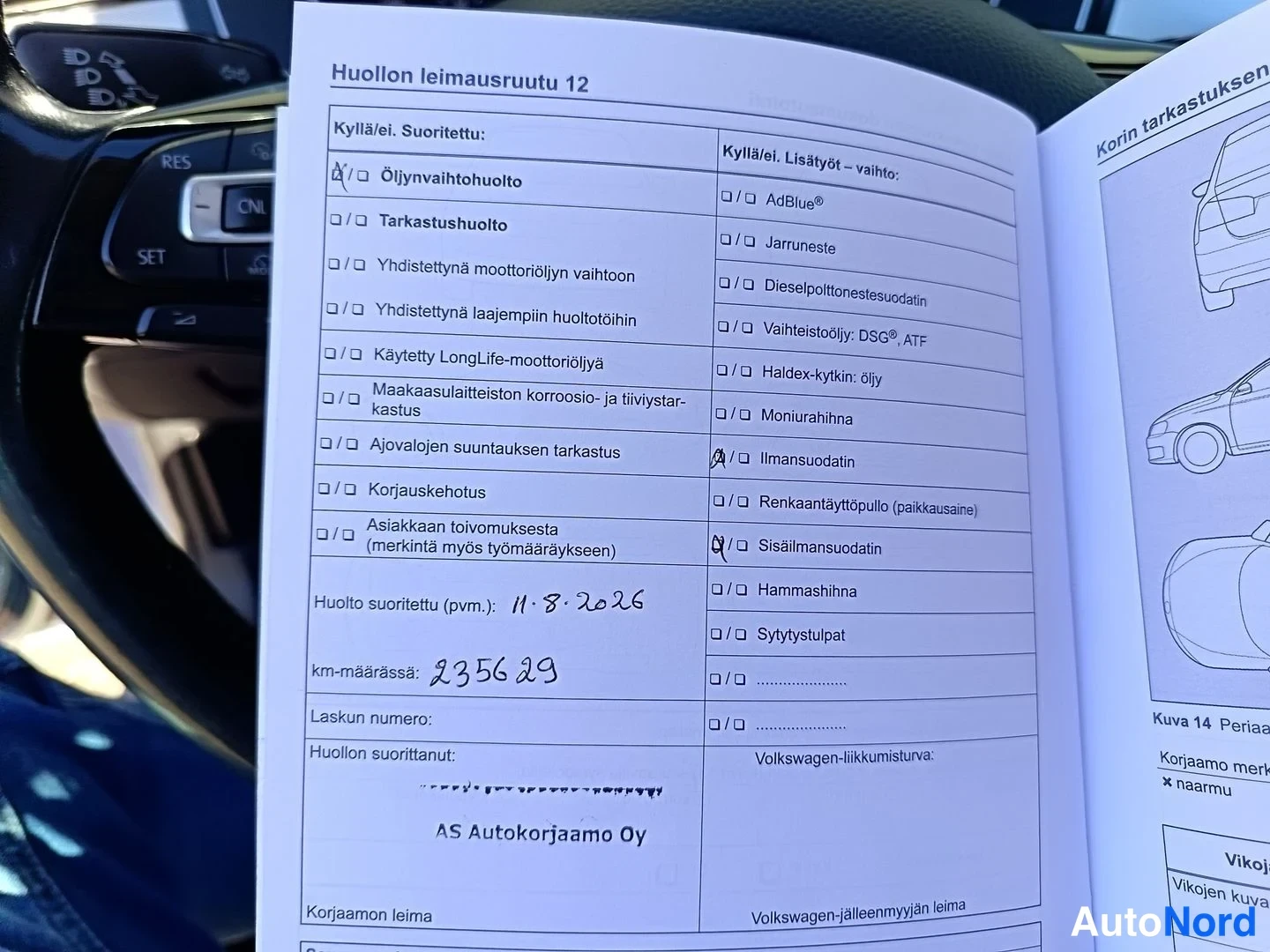 Asiakirja: Service booklet open to page titled 'Huollon leimausruutu 12'. Visible is a checklist for maintenance tasks and a section below marked with a check, dated 11.8.