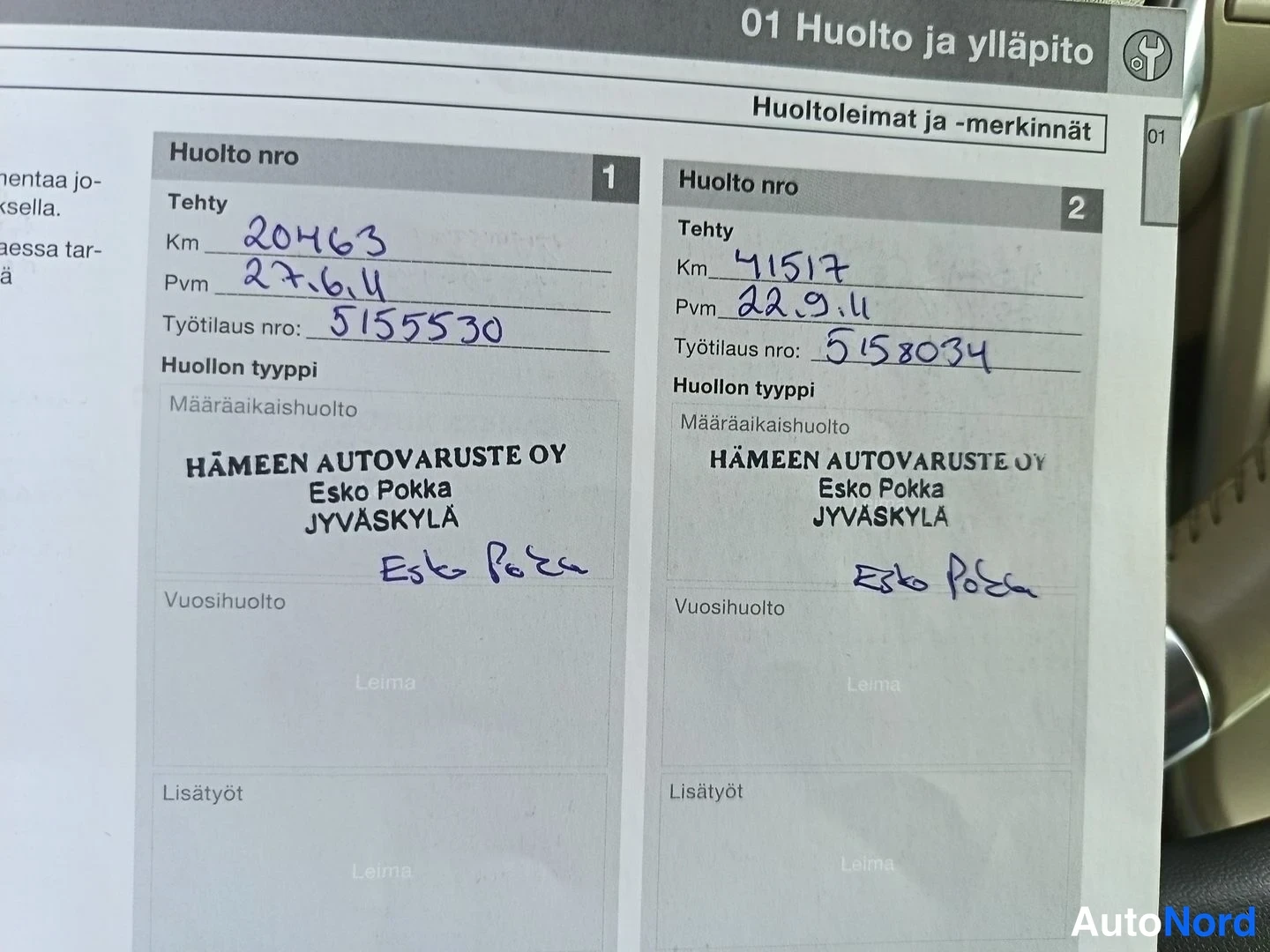 Asiakirja: Service book page showing two service entries (Huolto nro 1 and 2) with handwritten kilometers, dates, work order numbers, workshop name Hämeen Autovaruste Oy,