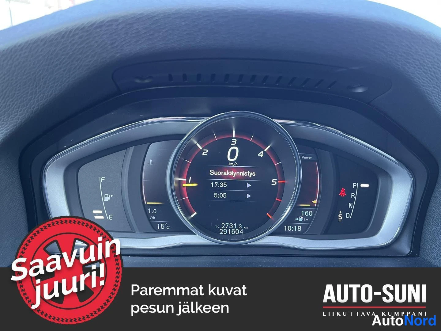 Sivulta: Mittariston lähikuva: nopeusmittari näyttää 0 km/h, matkamittari 291604 km ja polttoainemittari lähellä tyhjää.