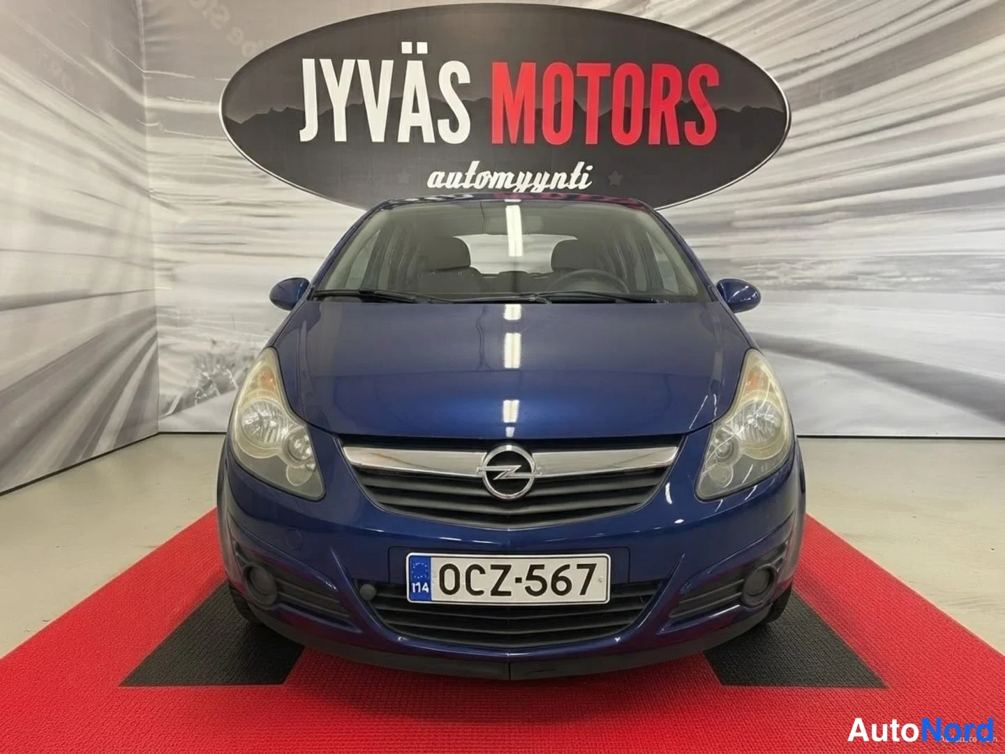 Sininen Opel Corsa 2011, edestä, kuva 3
