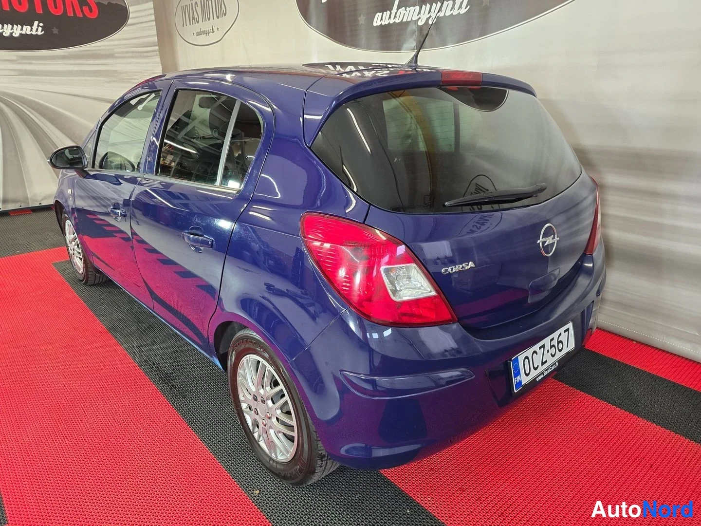 Sininen Opel Corsa 2011, takaviisto, kuva 4