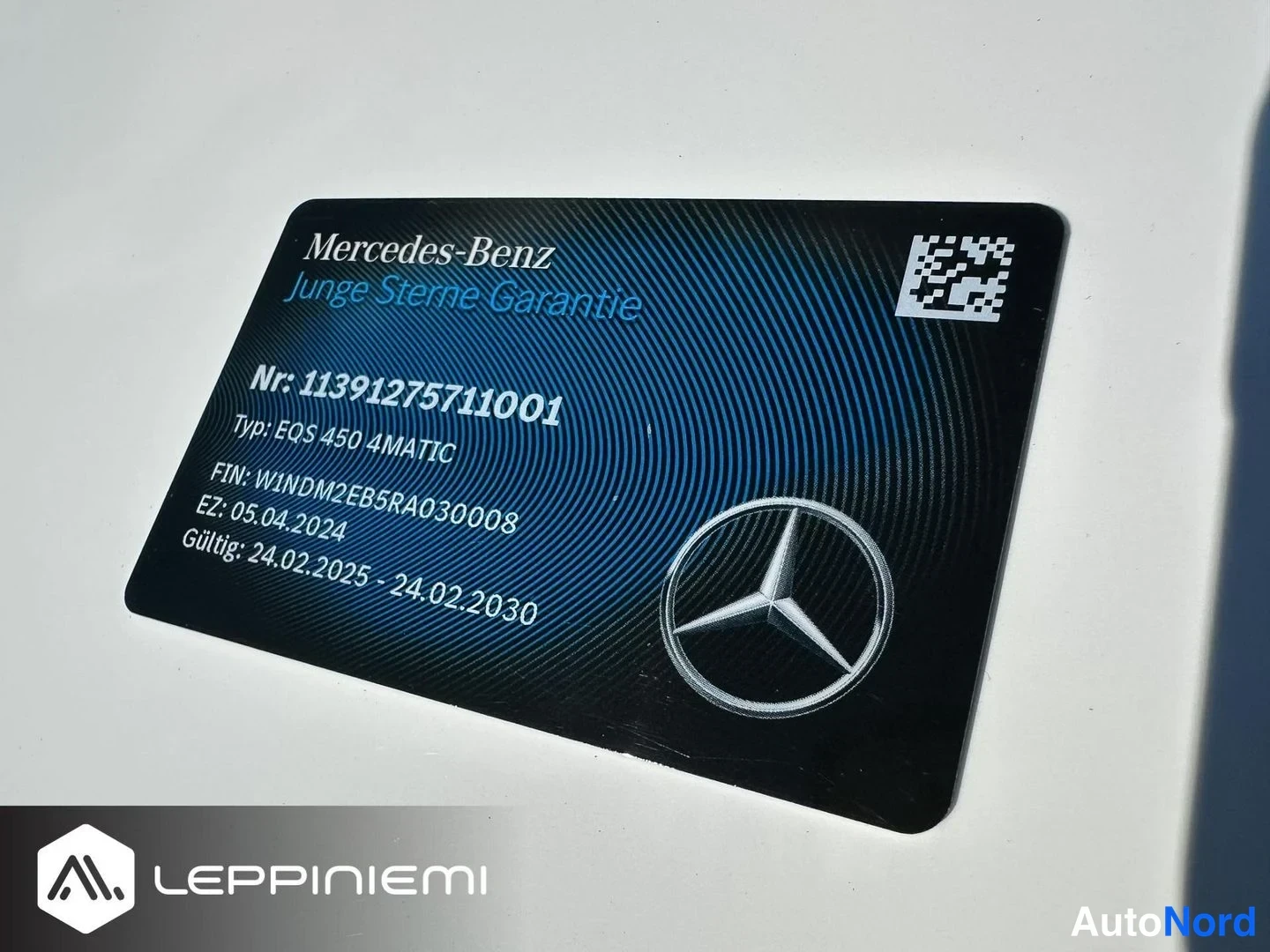 Asiakirja: Musta Mercedes-Benz Junge Sterne Garantie -kortti, jossa numerotiedot, VIN, EZ-päivä ja voimassaoloaika 24.02.2025–24.02.2030.