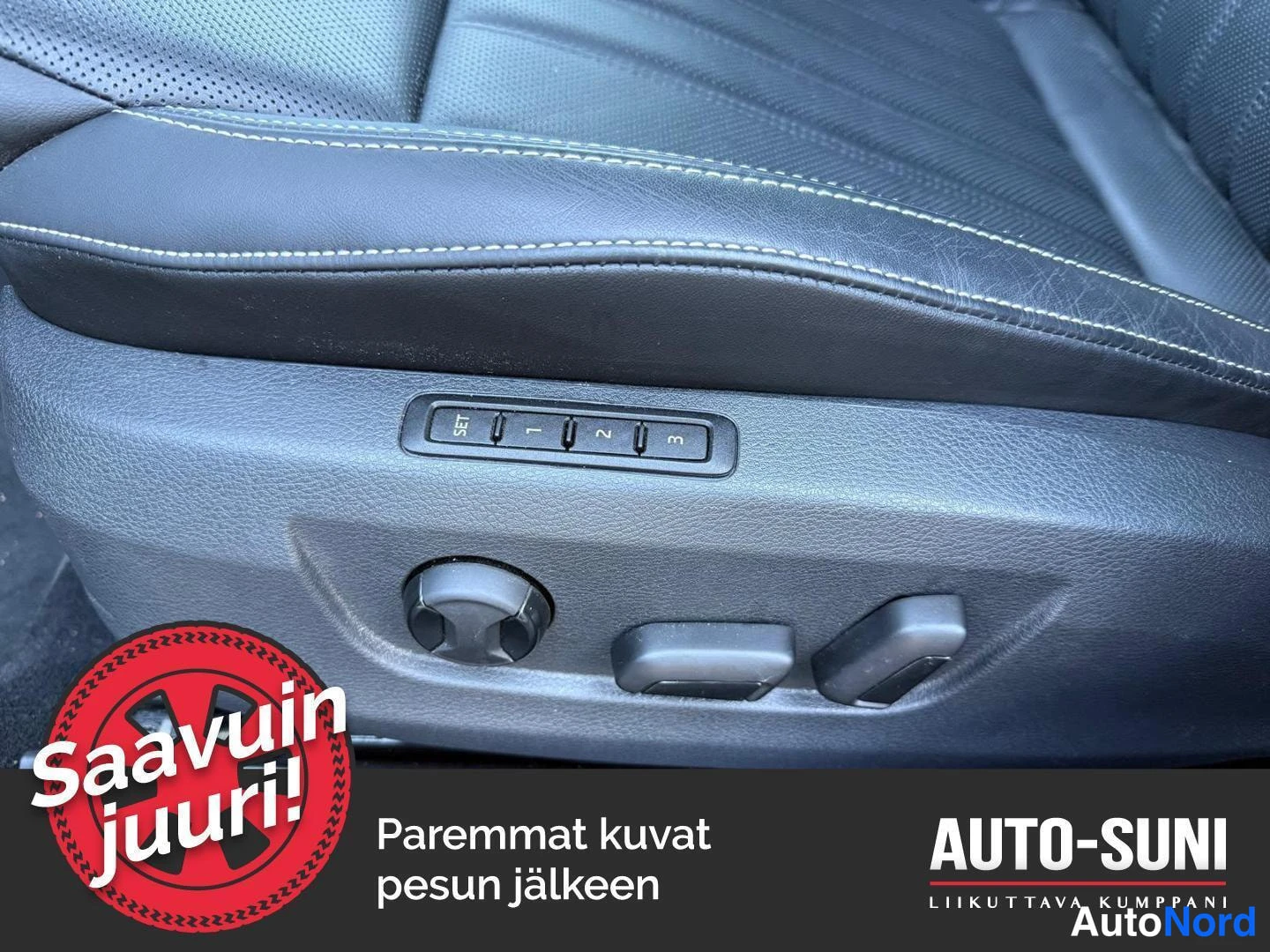 Muu: Sähköisesti säädettävän istuimen painikkeet (SET, 1, 2, 3) ja istuinsäädin, musta nahkaverhoilu.