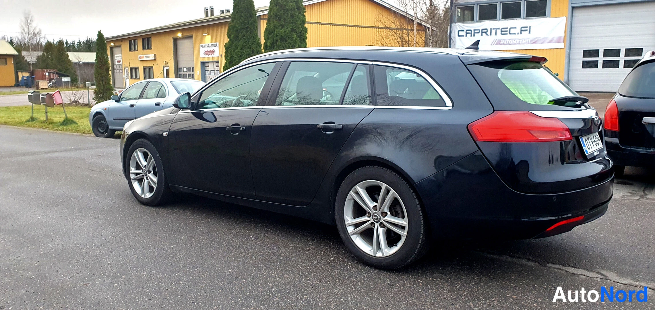 Musta Opel Insignia Sports Tourer 2013, takaviisto, kuva 7