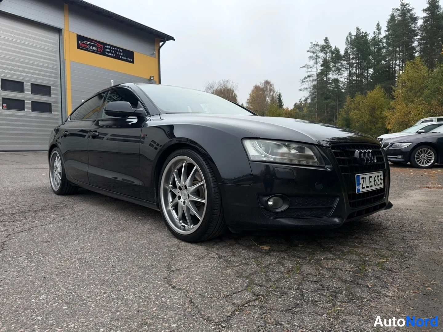 Musta Audi A5 Sportback 2011, etuviisto, keula oikealle, kuva 4