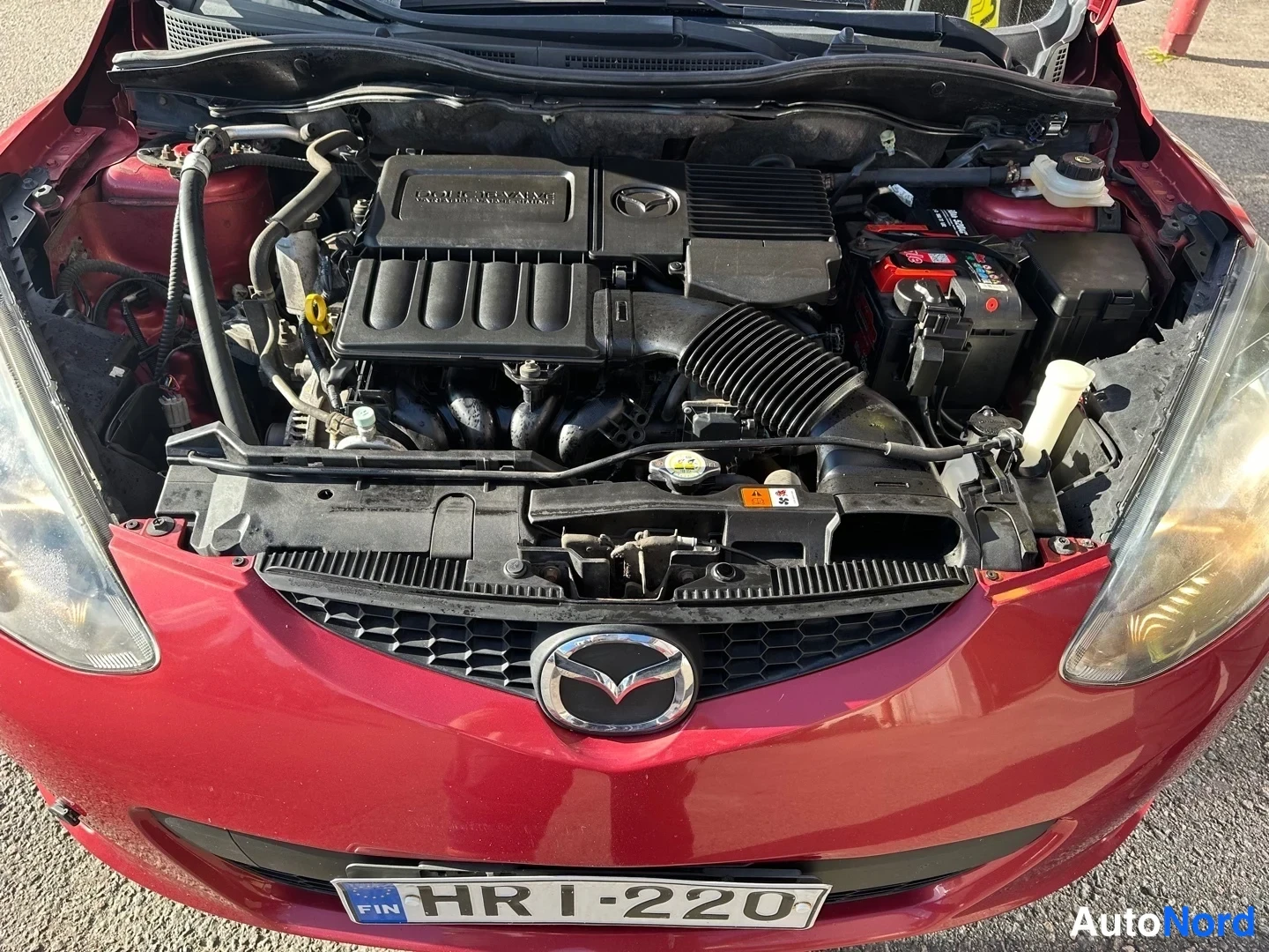 Red Mazda 2 2008, front, photo 3