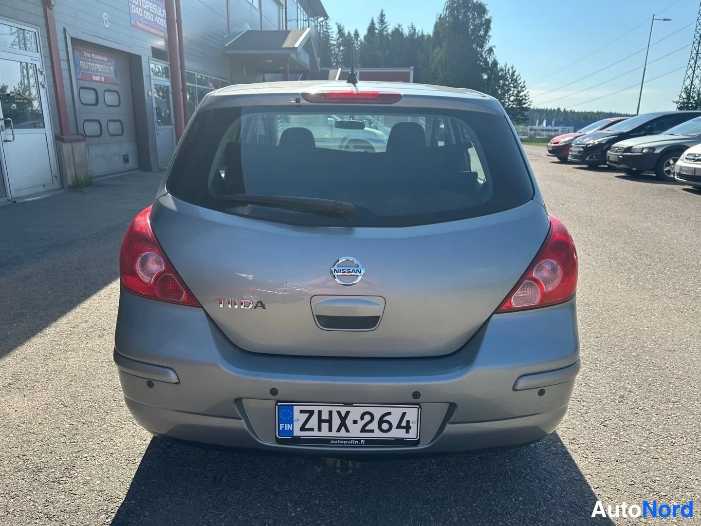 Grey Nissan Tiida 2010, rear, photo 11