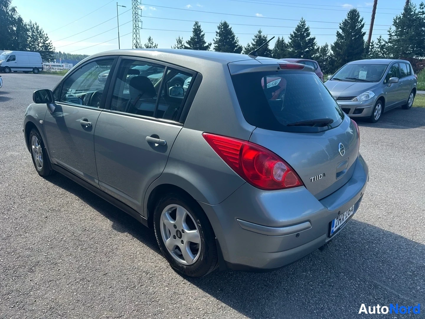Grey Nissan Tiida 2010, rear three-quarter, photo 9