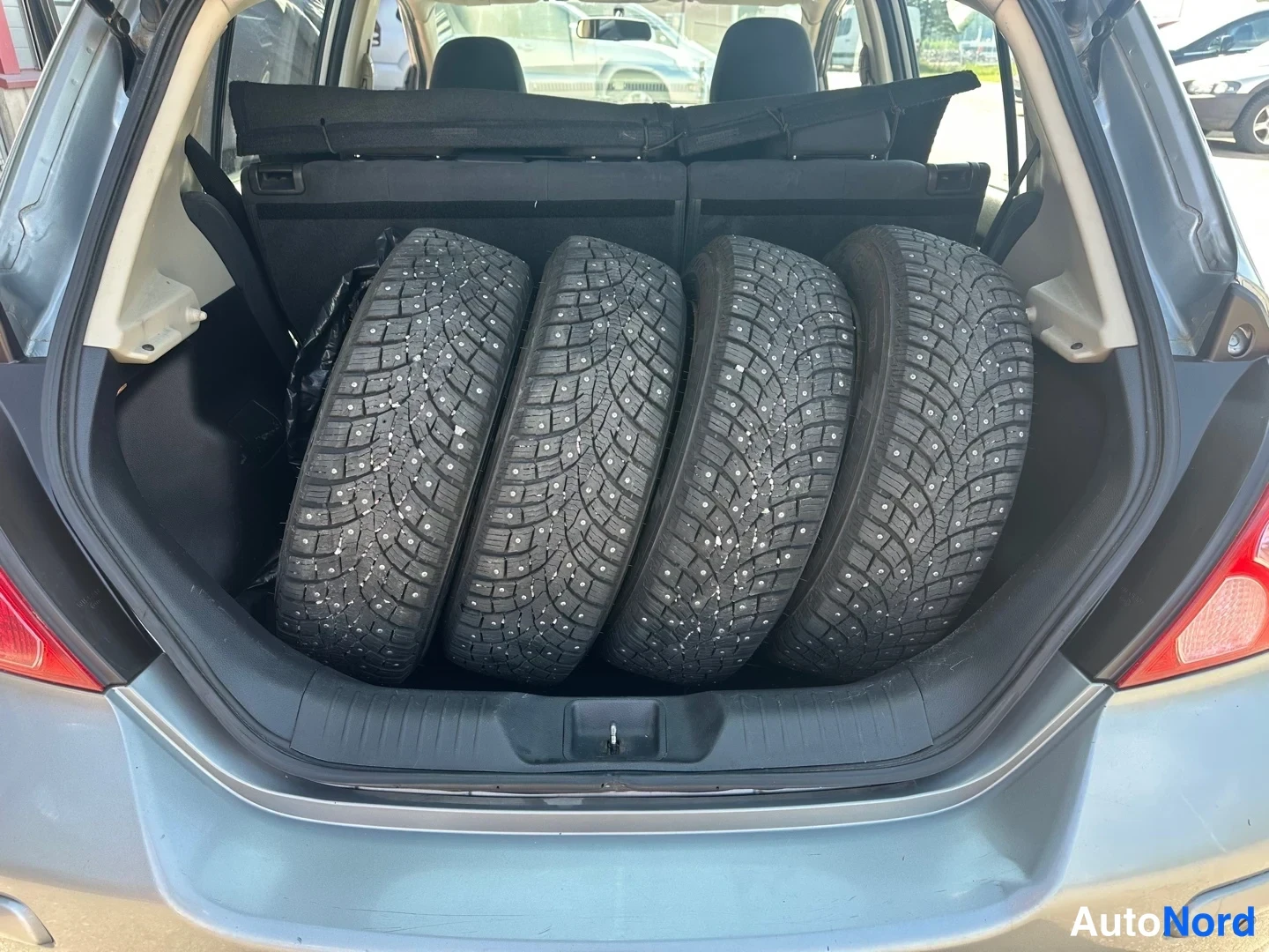 Grey Nissan Tiida 2010, rear, photo 10