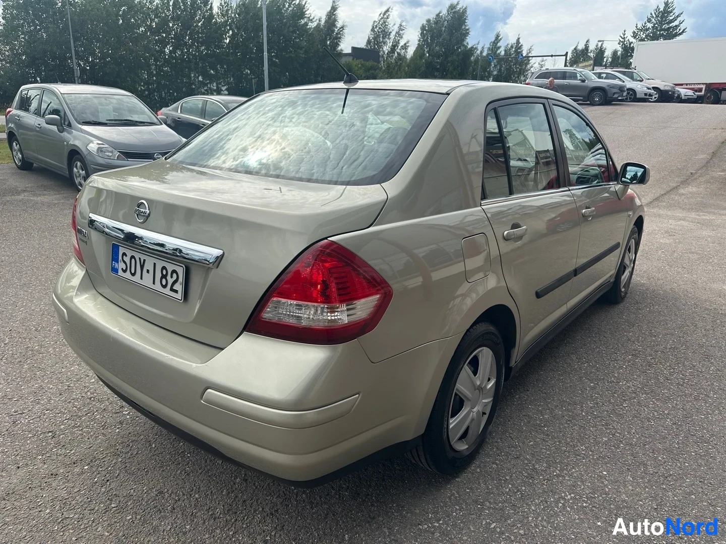 Beige Nissan Tiida 2007, rear three-quarter, photo 7