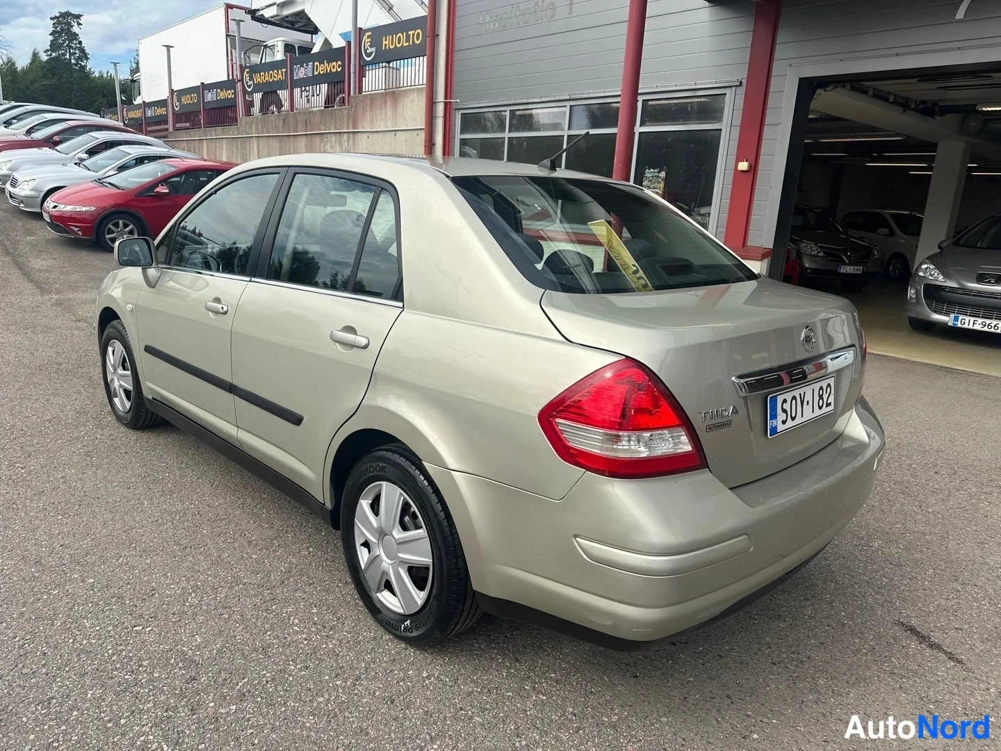 Beige Nissan Tiida 2007, rear three-quarter, photo 8