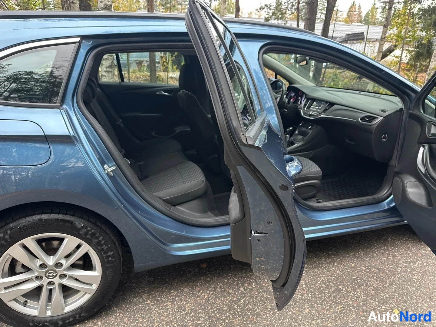 Blue Opel Astra 2016, side, photo 10