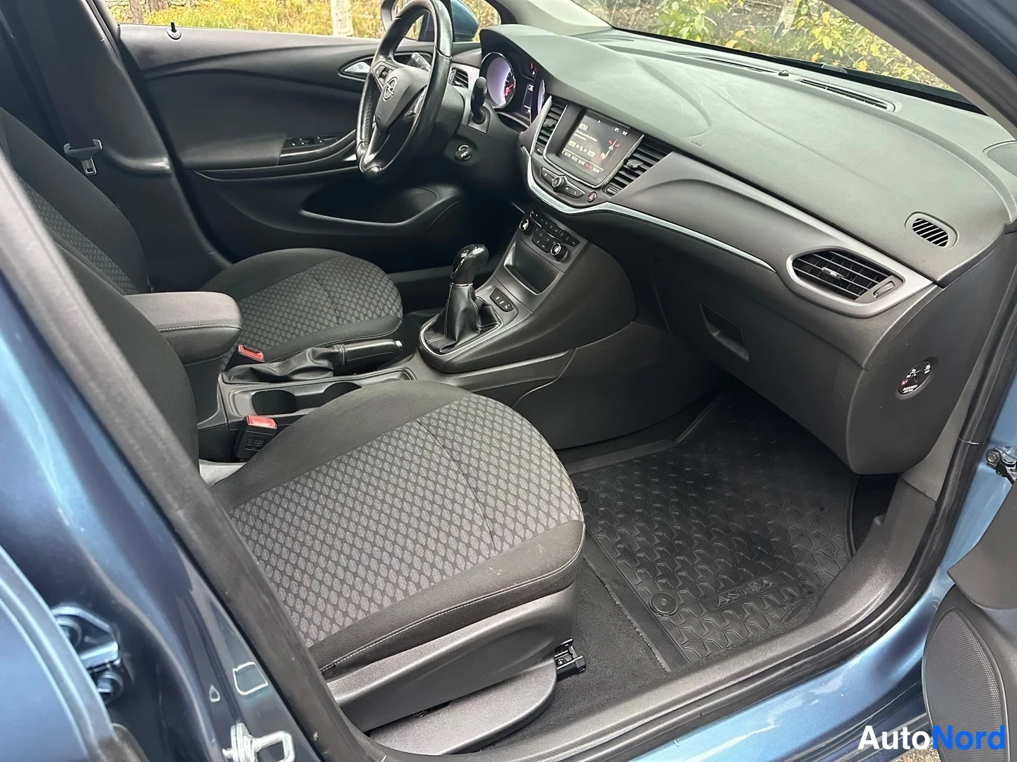 Blue Opel Astra 2016, side, photo 9