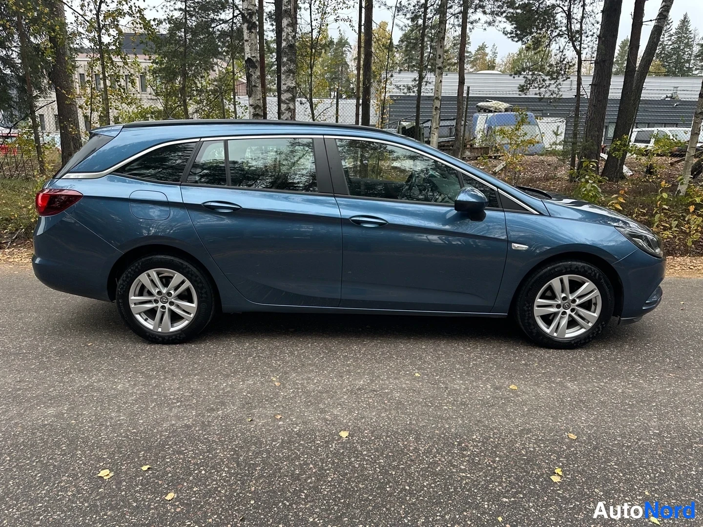 Blue Opel Astra 2016, side, photo 7