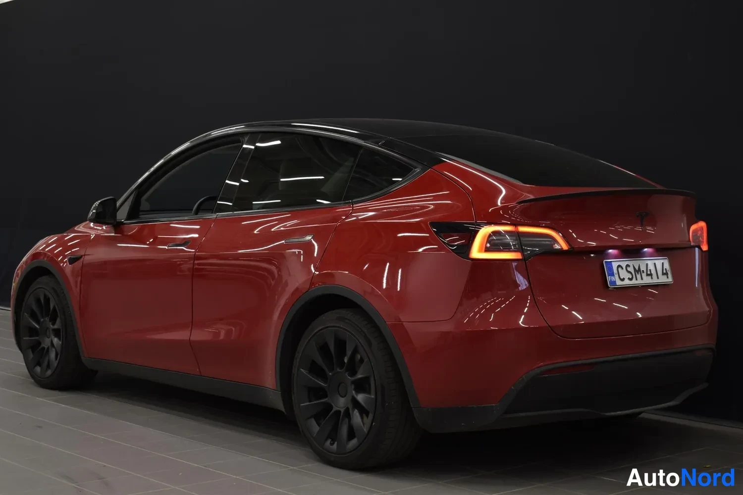 Red Tesla Model Y 2022, rear three-quarter, photo 4